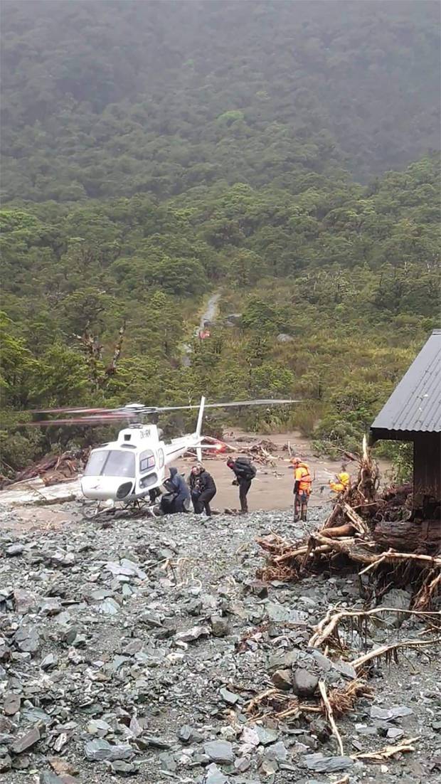 Trampers rescued from Howden Hut on the Routeburn Track on Tuesday. Photo: Grace Houpapa