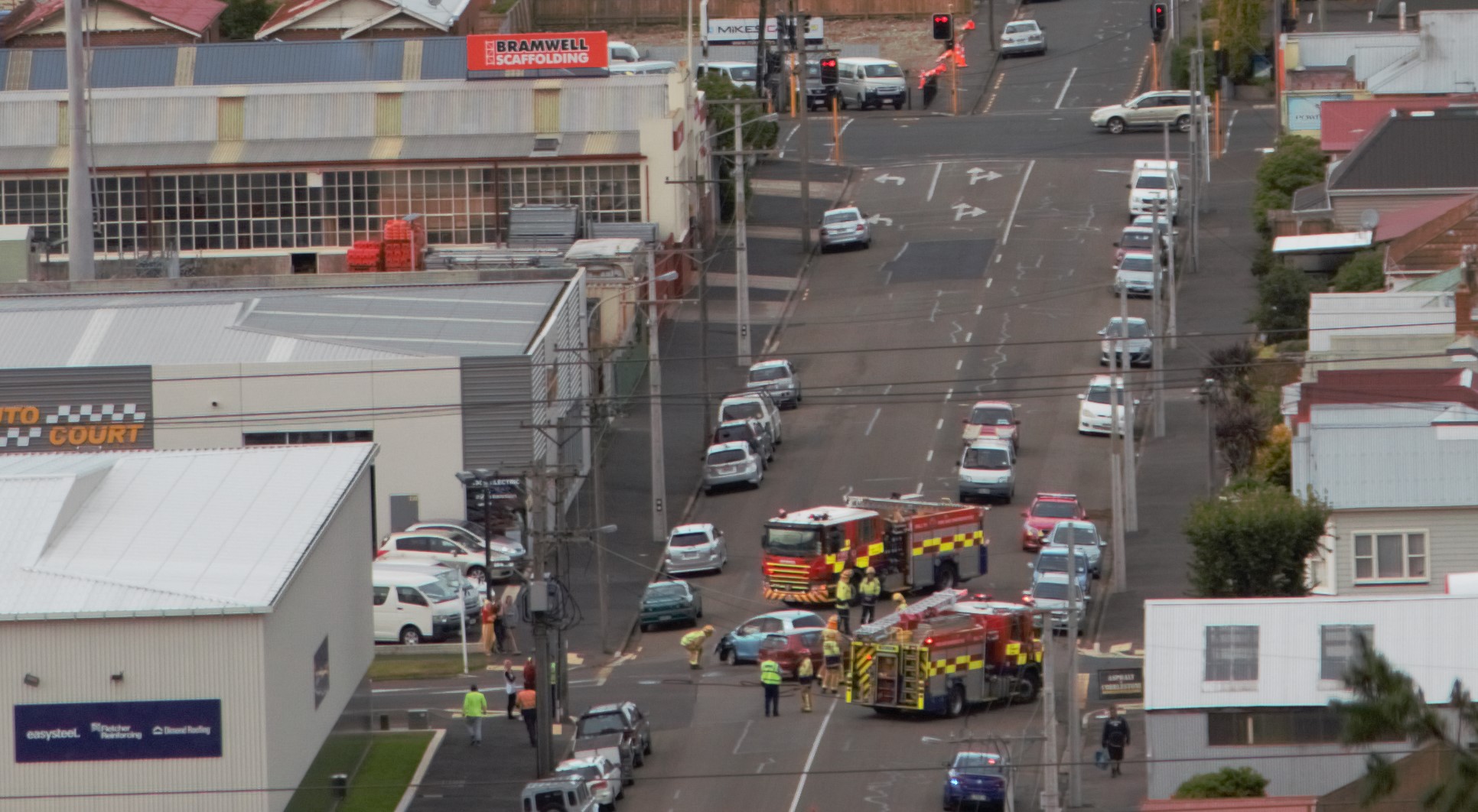 Emergency services at the scene of the crash in South Dunedin this morning. Photo: ODT