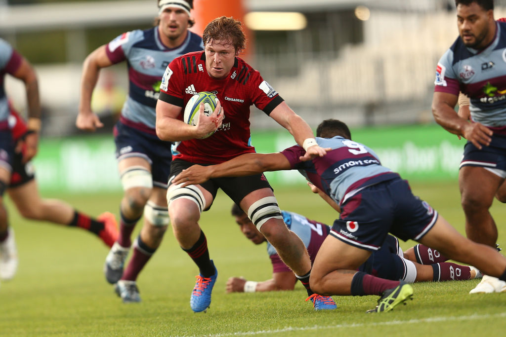 The Crusaders' Cullen Grace makes a break against the Reds. Photo: Getty