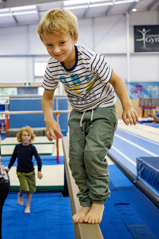 Clayton Cheatum on the balance beam. Photo: Geoff Sloan