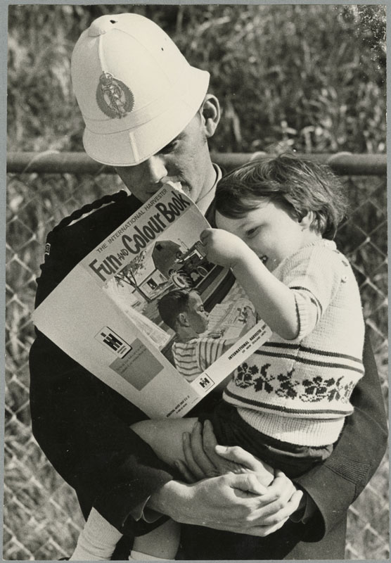 A police officer with a lost child at the 1970 show.