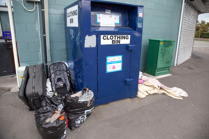 Rubbish littered around a collection bin on Grampian Rd, Casebrook.