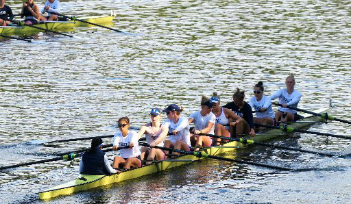 Veronica Wall (in sunglasses) in the stroke seat in a Yale eight boat.