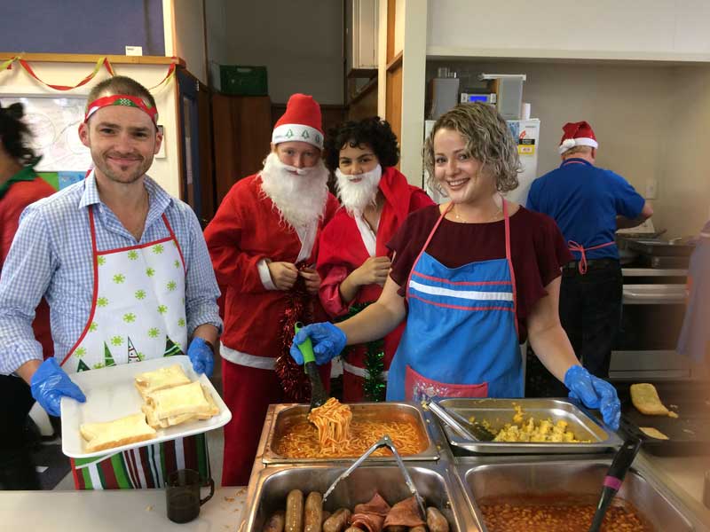 GIVING BACK: Community worker Damian Ardell (right) with Chloe and Malachi (middle) and Alyssa...