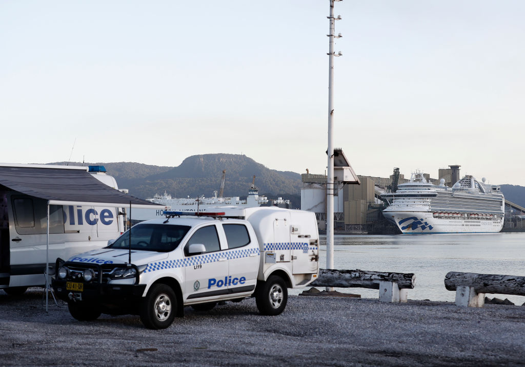 A police van is seen in front of the Ruby Princess docked at Port Kembla in Wollongong. Photo:...