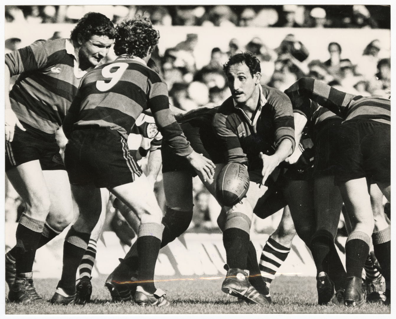 Canterbury flanker Jack Hobbs passes the ball to halfback Bruce Deans during the 1985 Canterbury...