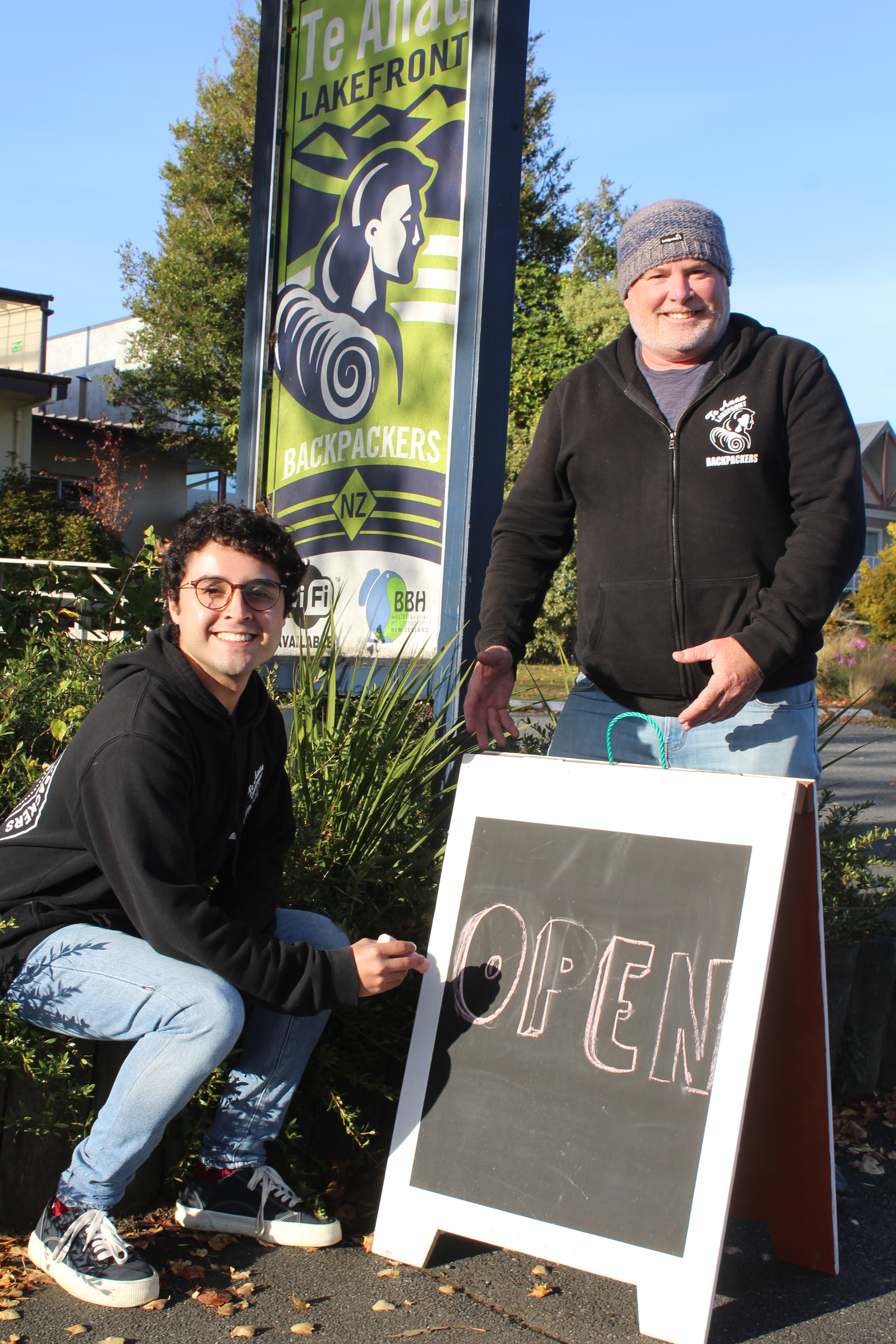 Te Anau Lakefront Backpackers receptionist Giovanni Gomez and owner Dean Costello invite guests...