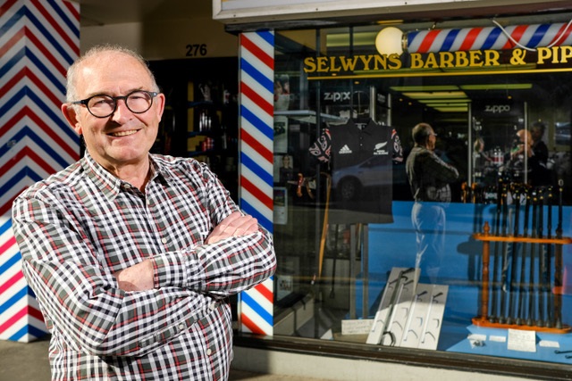 Selwyn Grave outside his barber shop in Moray Place. Photo: Suuplied