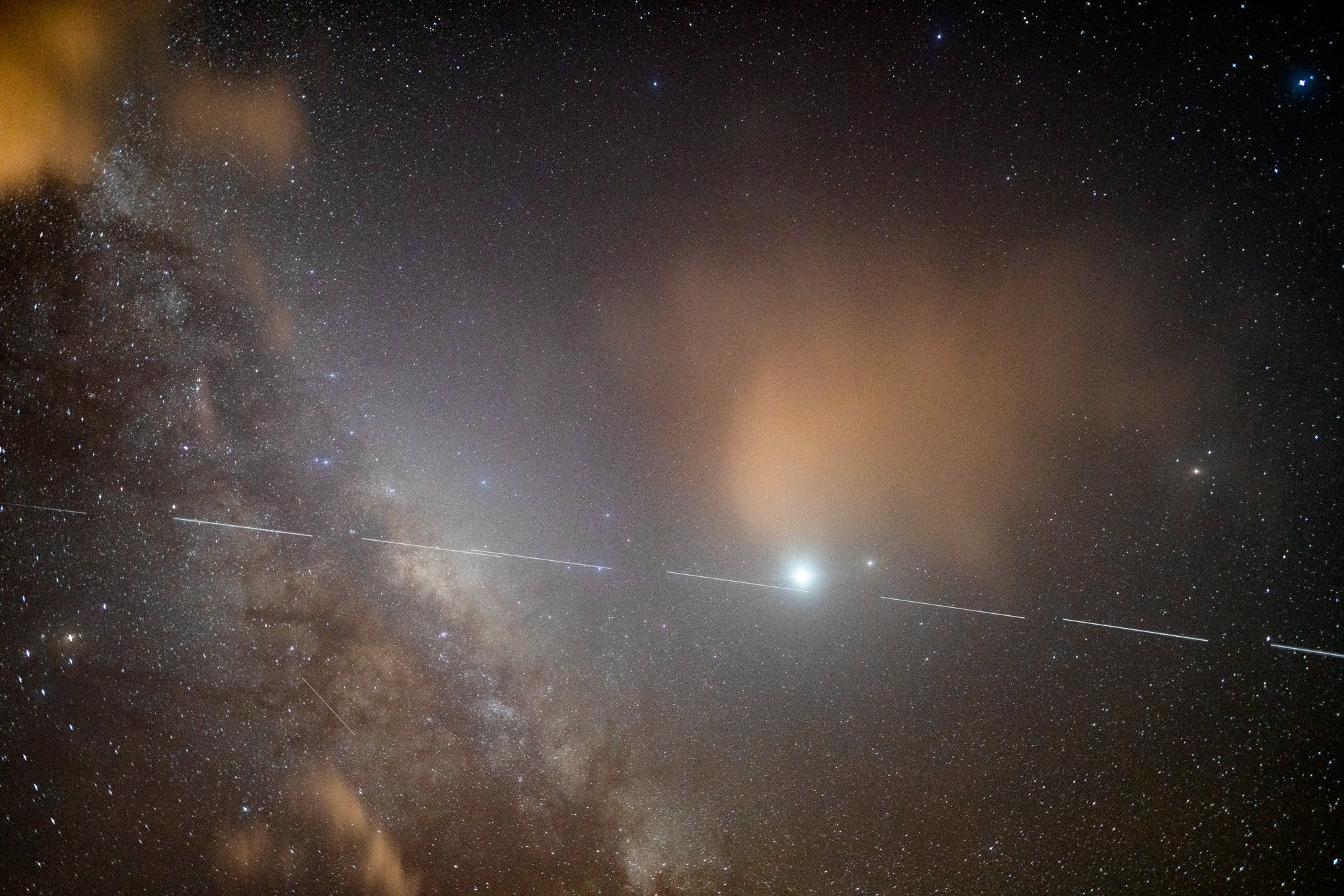 SpaceX Starlink satellites fly high above Papanui inlet. Photo: Ian Griffin