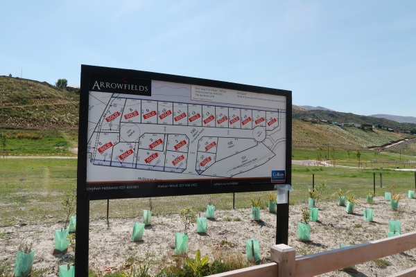 'Sold' signs populate this billboard at Arrowfields. Photo: Mountain Scene