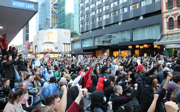 Protesters took a knee with fists up outside the US embassy building in Auckland on 1 June, 2020,...