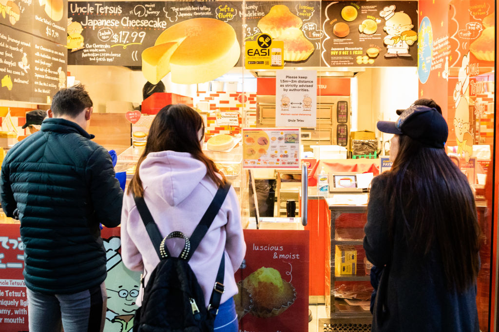 Patrons lined up outside a Japanese cheesecake shop in Melbourne after Covid restrictions were...