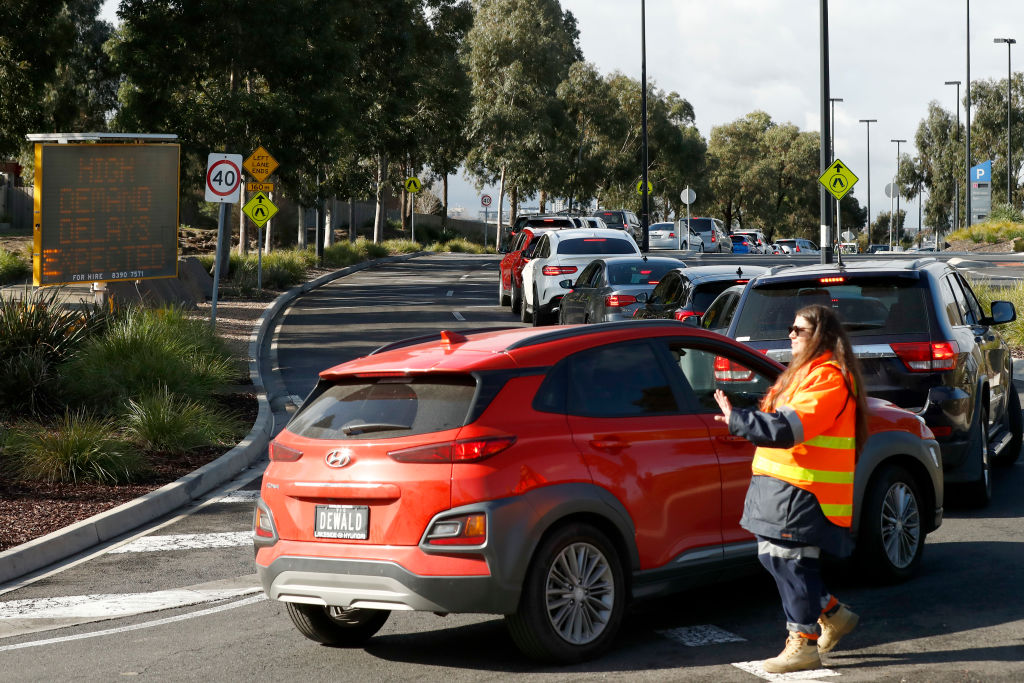 People flock to a shopping centre for a Covid-19 test in Melbourne after 17 new cases were...