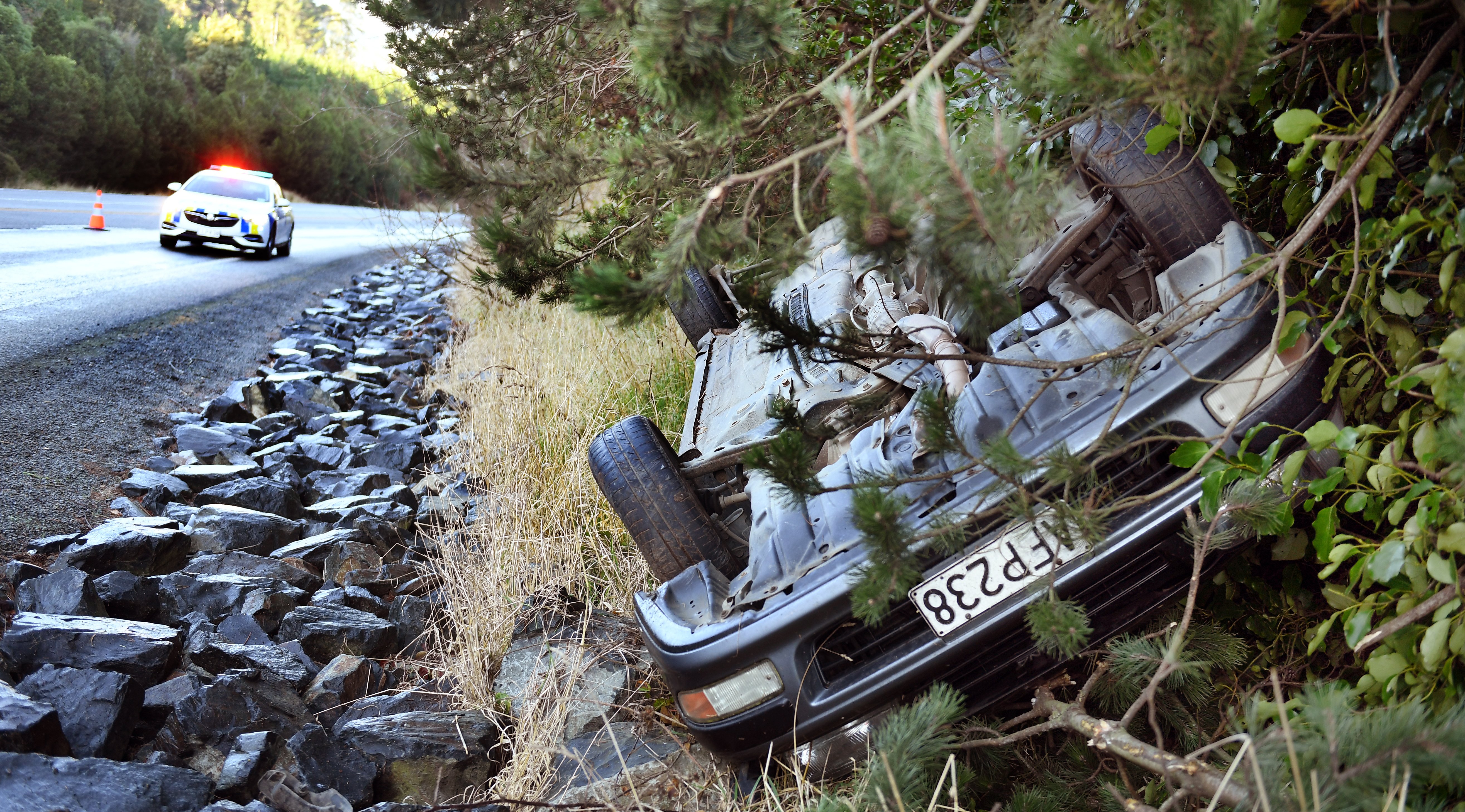 A car rolled on to its roof after coming off the road on State Highway 1, above Evansdale Glen,...