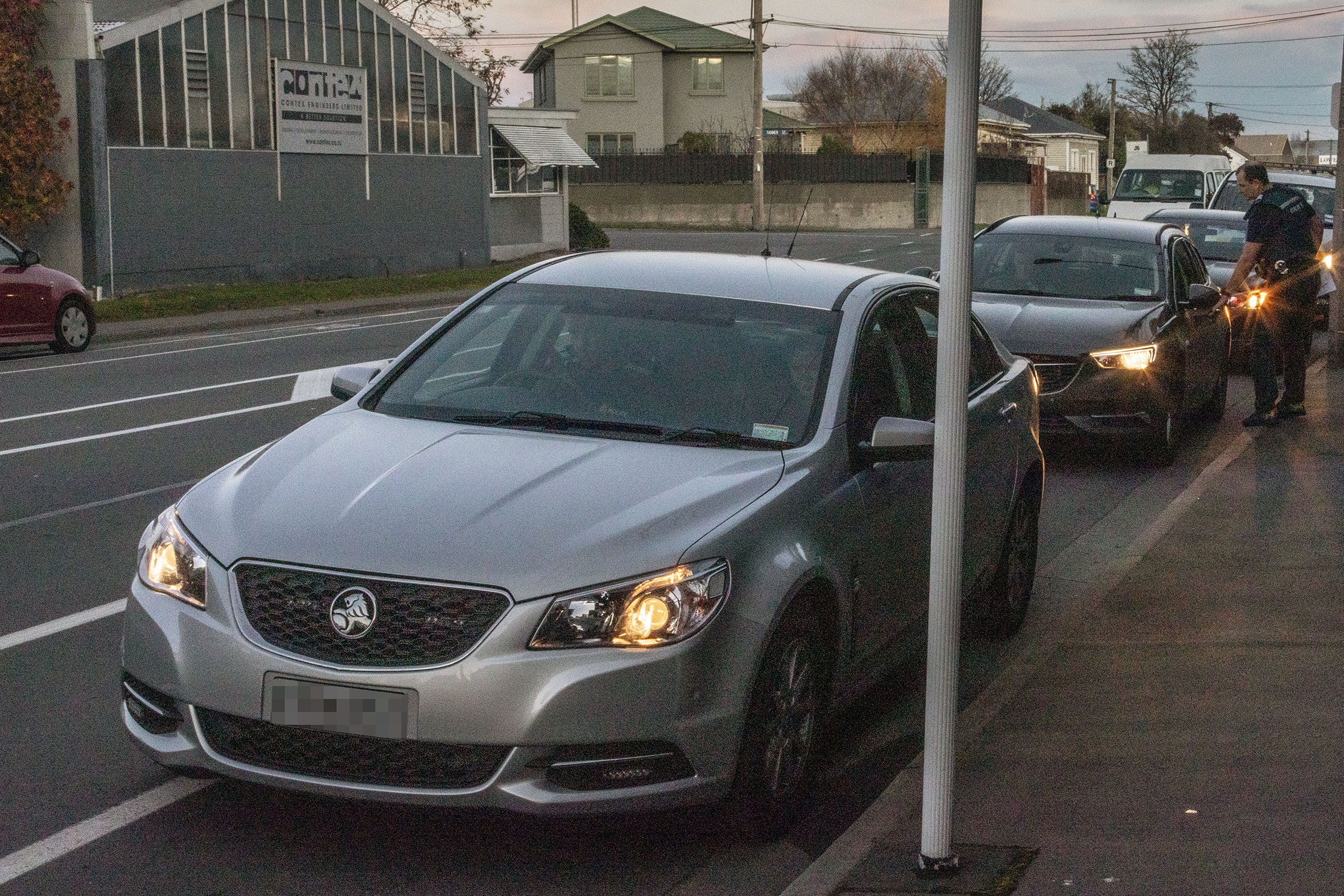 Police arrive to execute a search warrant in Woolston. Photo: Geoff Sloan