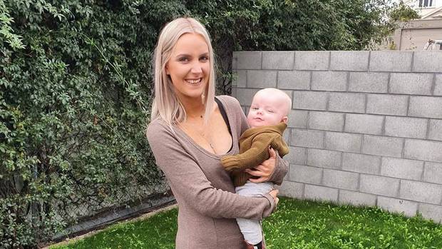 Kayla Miller, with her son Freddie, has been awarded $20,000 after her bullying claims at work...