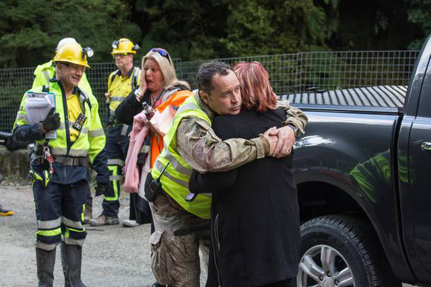 Anna Osborne, whose husband Milton died in the mine explosion, hugs a Pike River Recovery Agency...