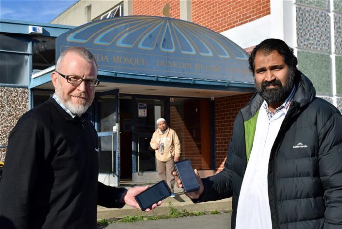 Displaying safety measures outside Al Huda mosque in North Dunedin are (from left) Otago Muslim...