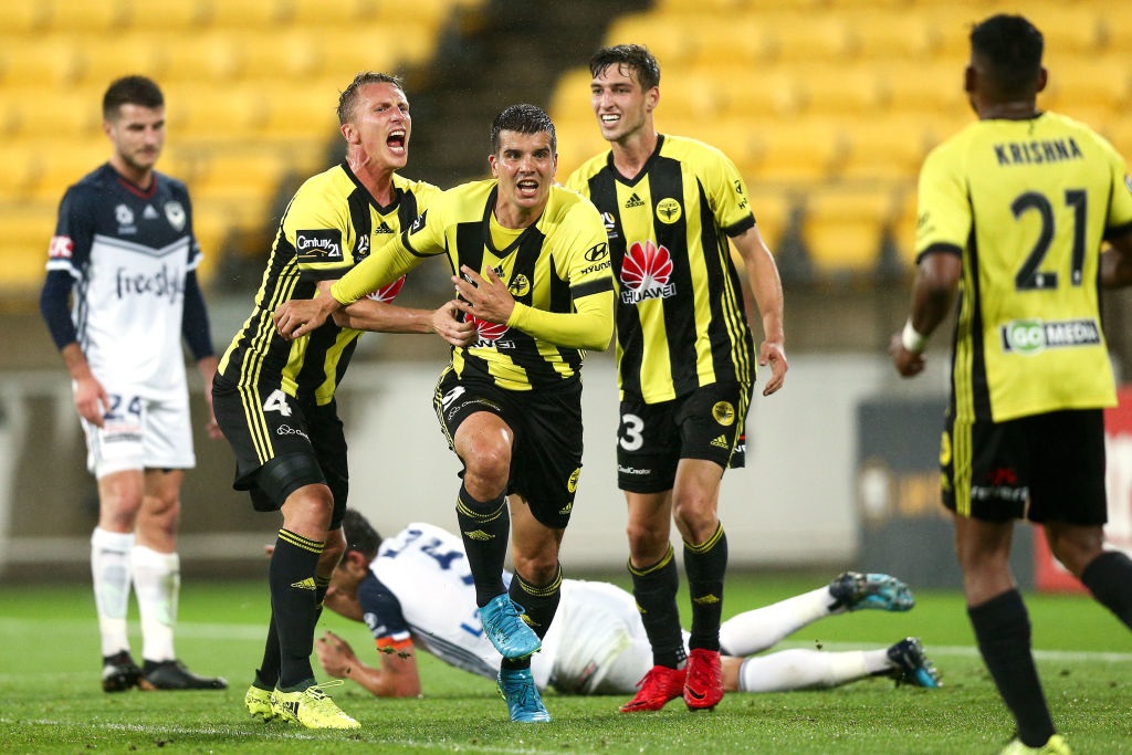 Andrija Kaludjerovic, Goran Paracki and Matthew Ridenton of the Wellington Phoenix celebrate an...