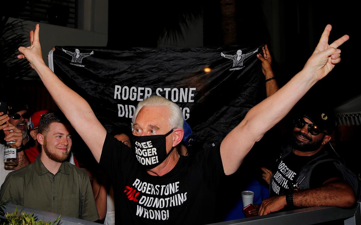 Roger Stone reacts outside his home in Fort Lauderdale, Florida, after US President Donald Trump...