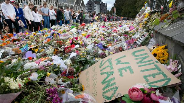 The crowds that had gathered in Hagley Park, Christchurch after the shooting. Photo: Alan Gibson ...