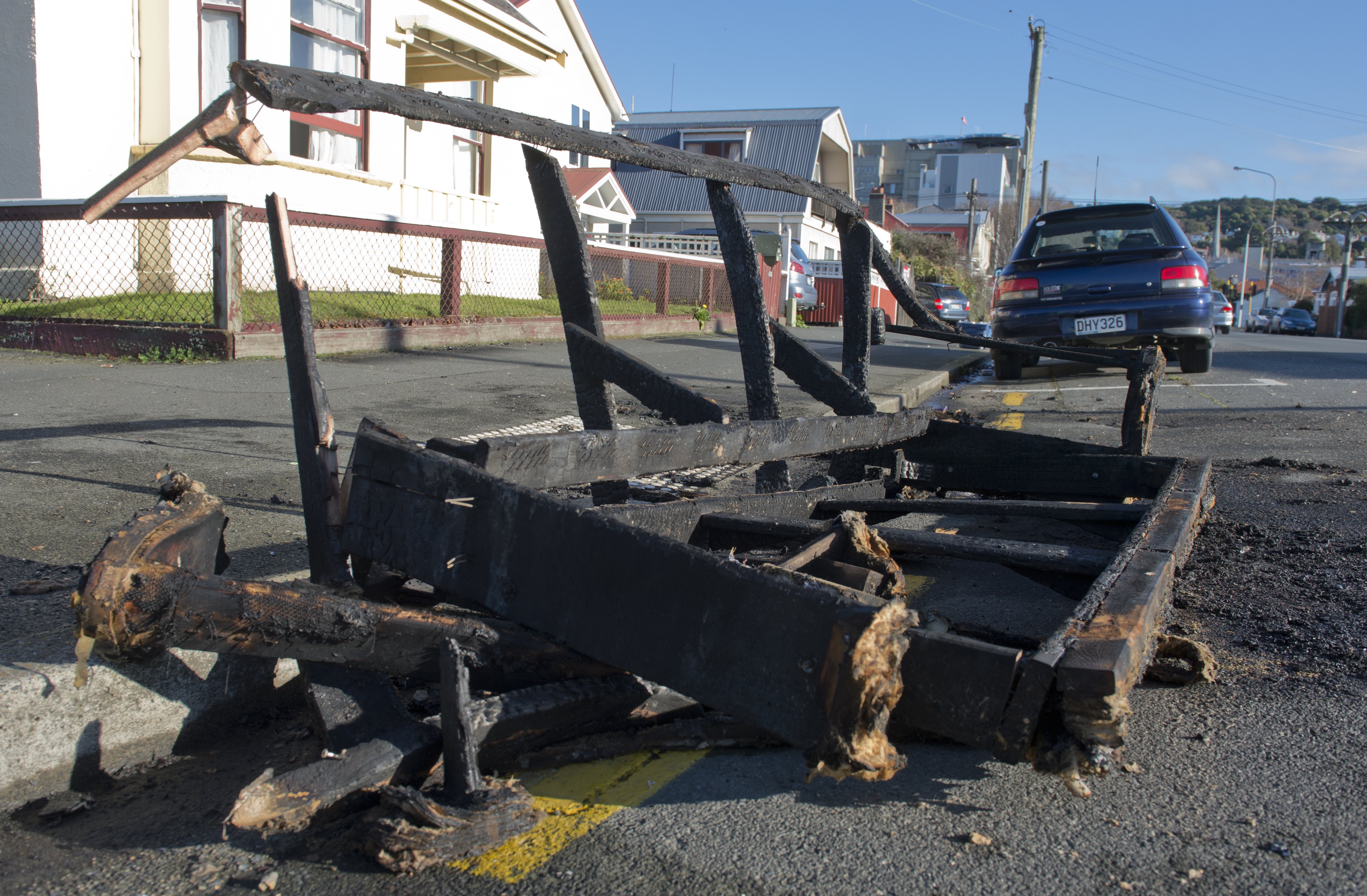 The remnants of a couch sit on the corner of Leith and Frederick Sts yesterday following a busy...