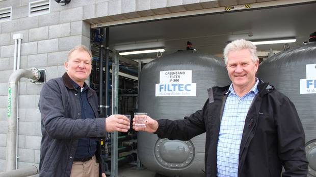 South Taranaki Deputy Mayor Rob Northcott (left) and Mayor Phil Nixon toast Waverley's new water...