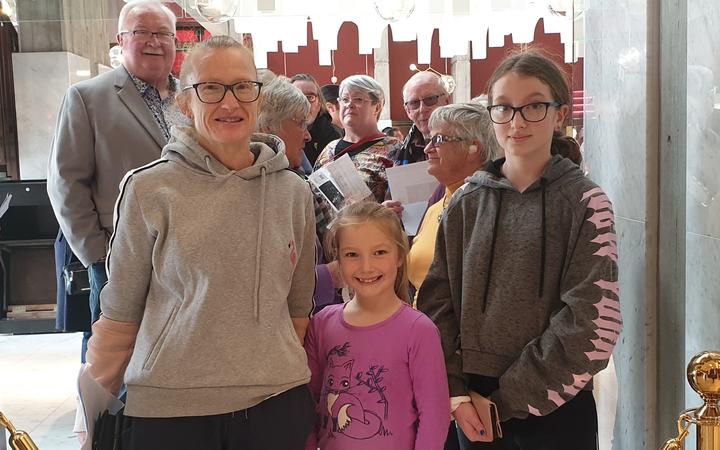 Vanessa Davidson and her daughters, Jessie and Maddison, were at the head of the queue. Photo:...