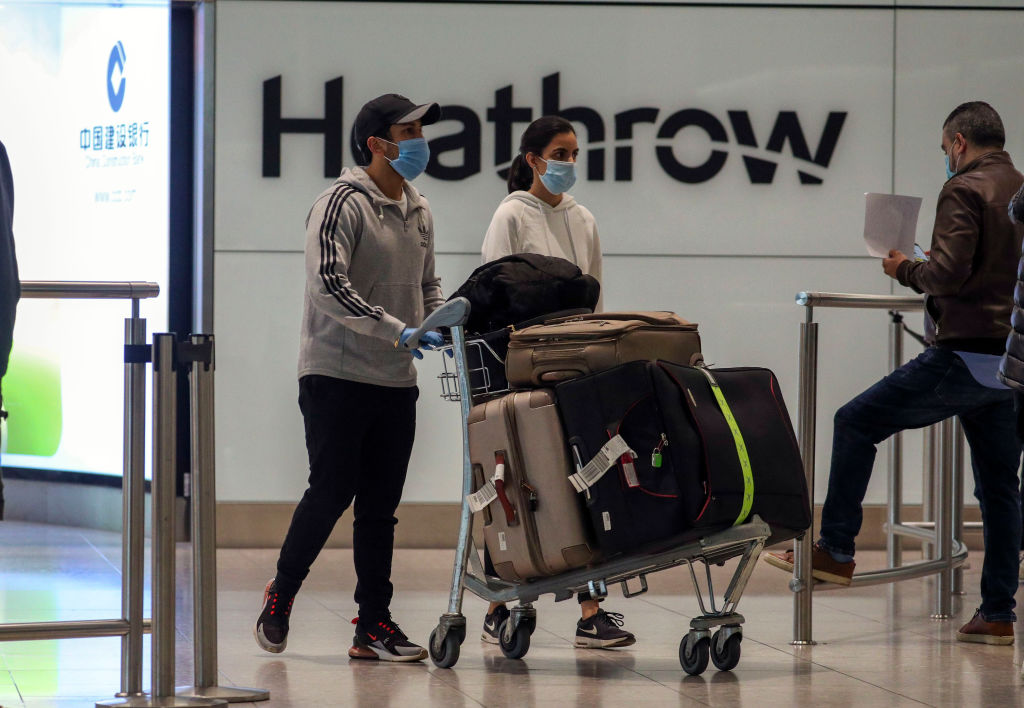 Passengers in the arrivals lounge in Terminal 2 at Heathrow Airport in London. Photo: Getty
