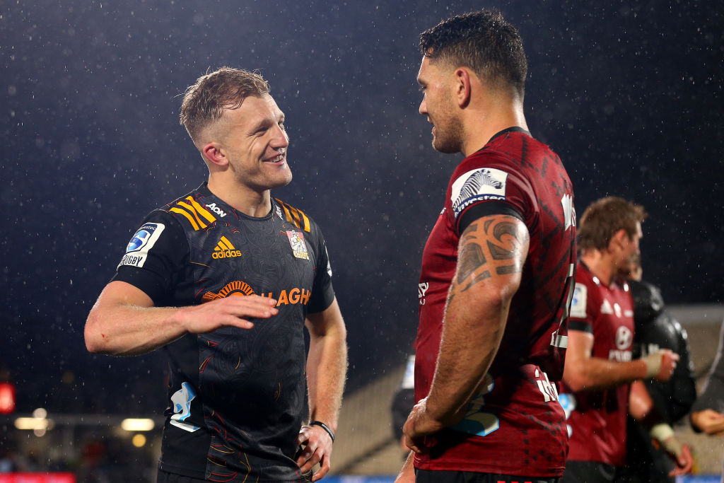 Damian McKenzie of the Chiefs talks with Codie Taylor of the Crusaders. Photo: Getty Images