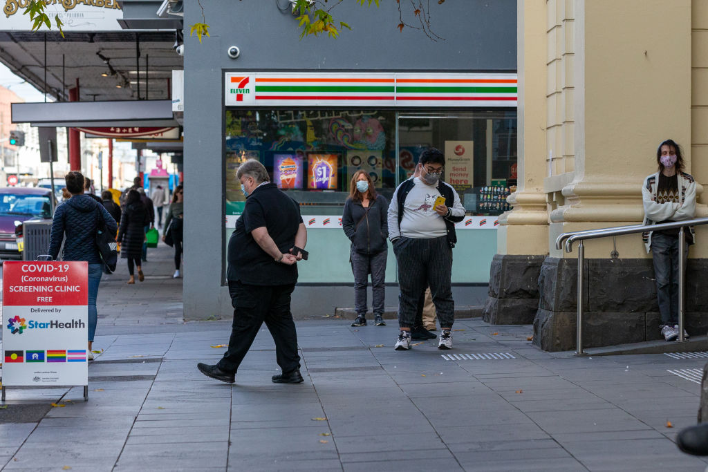 People line up outside a Covid-19 screening clinic in the inner city Melbourne suburb of Prahran....