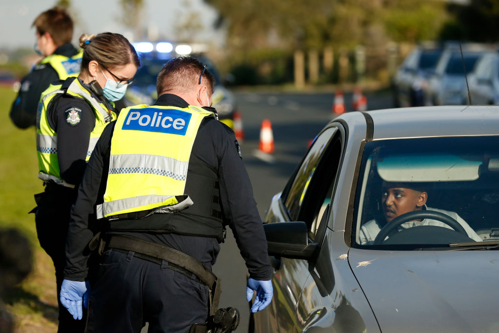 Police carry out random mask checks on motorists at St Kilda's Marine Parade in Melbourne at the...