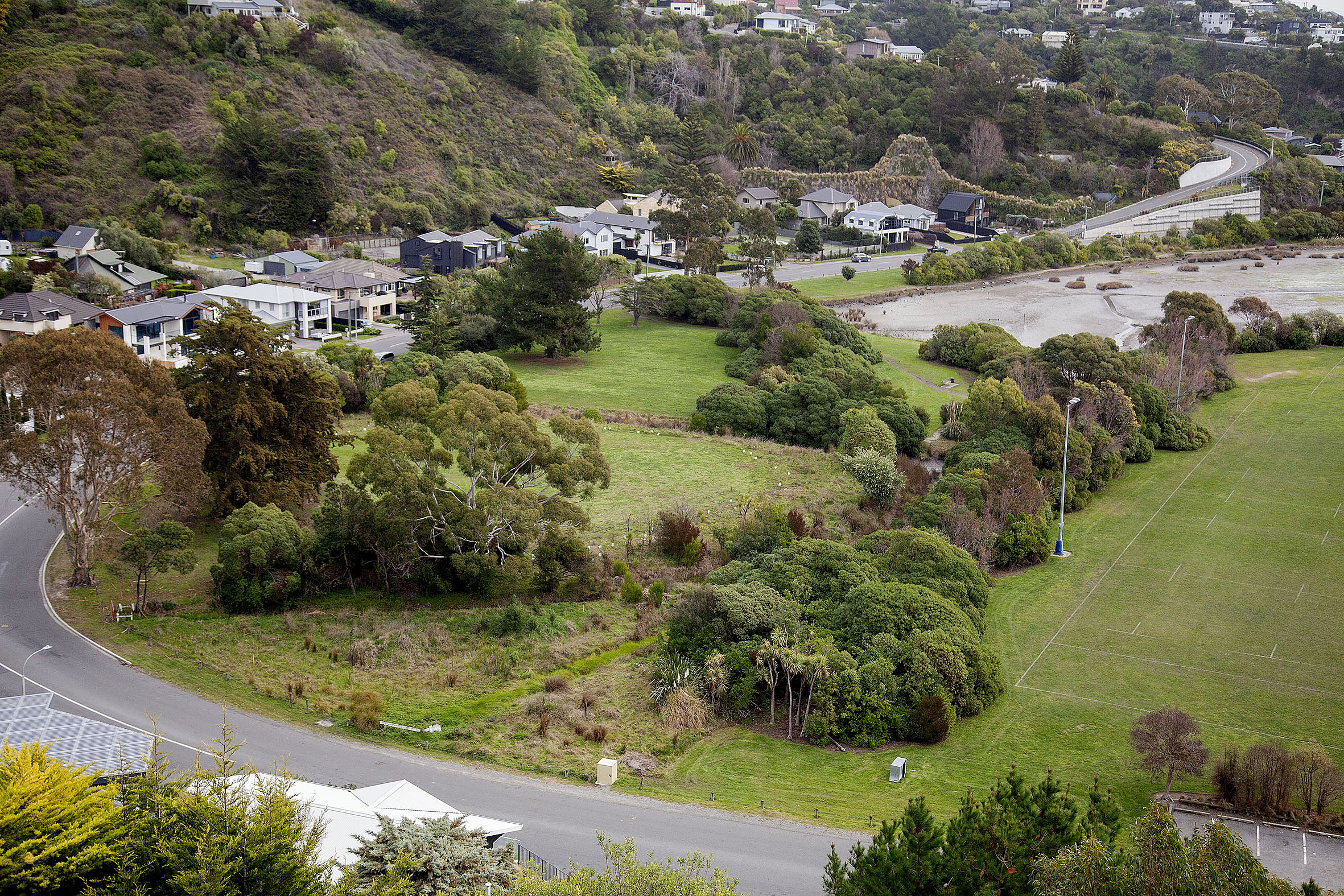 There are fears historic landfill sites like this one in McCormacks Bay could cause an ecological...