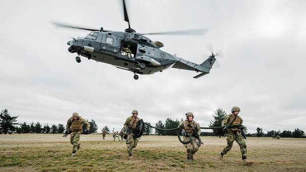 Fast-roping from a military helicopter is a quick method of troop insertion. Photo: Sean Spivey,...