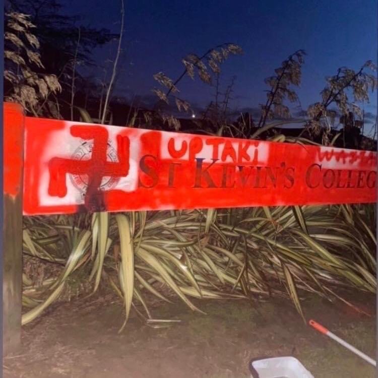 Graffiti, including a swastika, spray-painted on the sign at the main entrance to St Kevin’s...