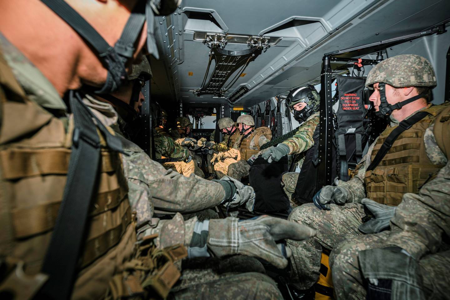 The well-trained soldiers don't hesitate before leaping from the NH90 helicopter. Photo: Sean...