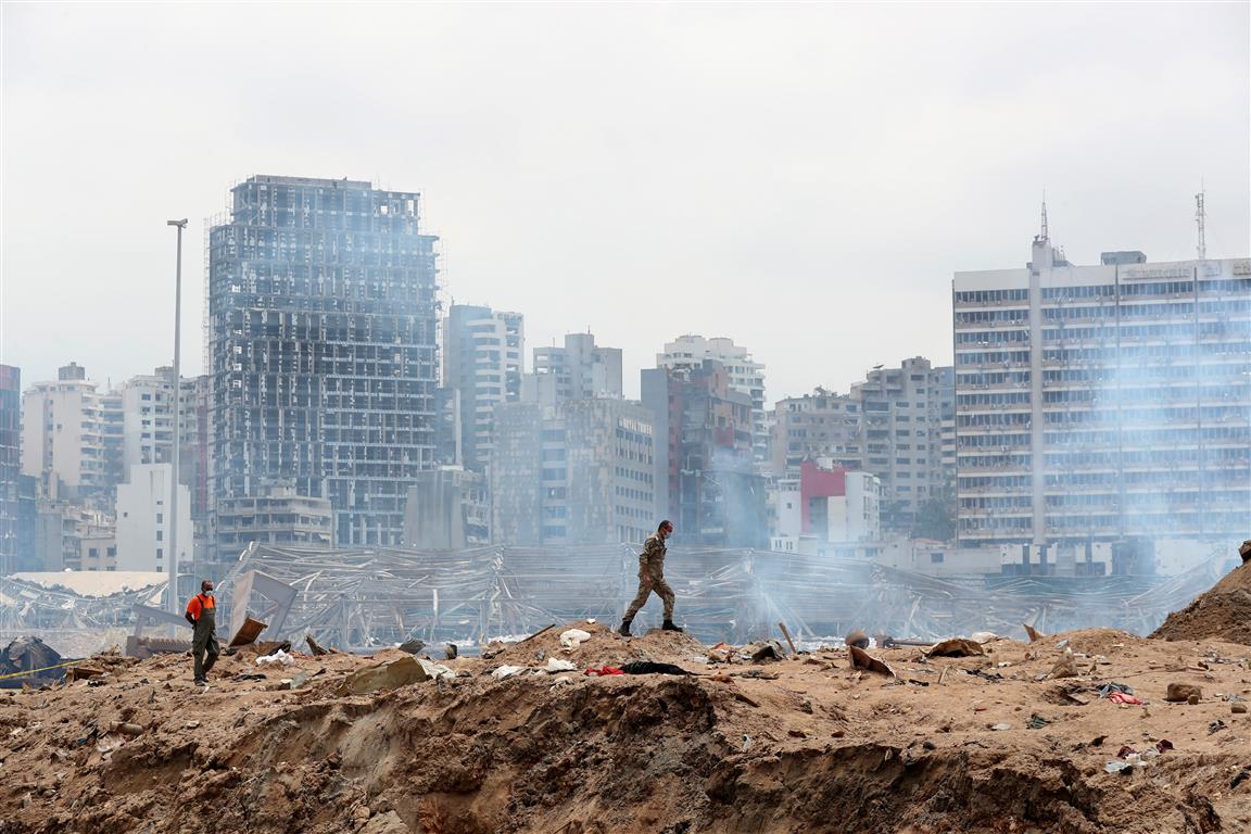 A soldier walks at the explosion site at the port of Beirut. Photo: Reuters