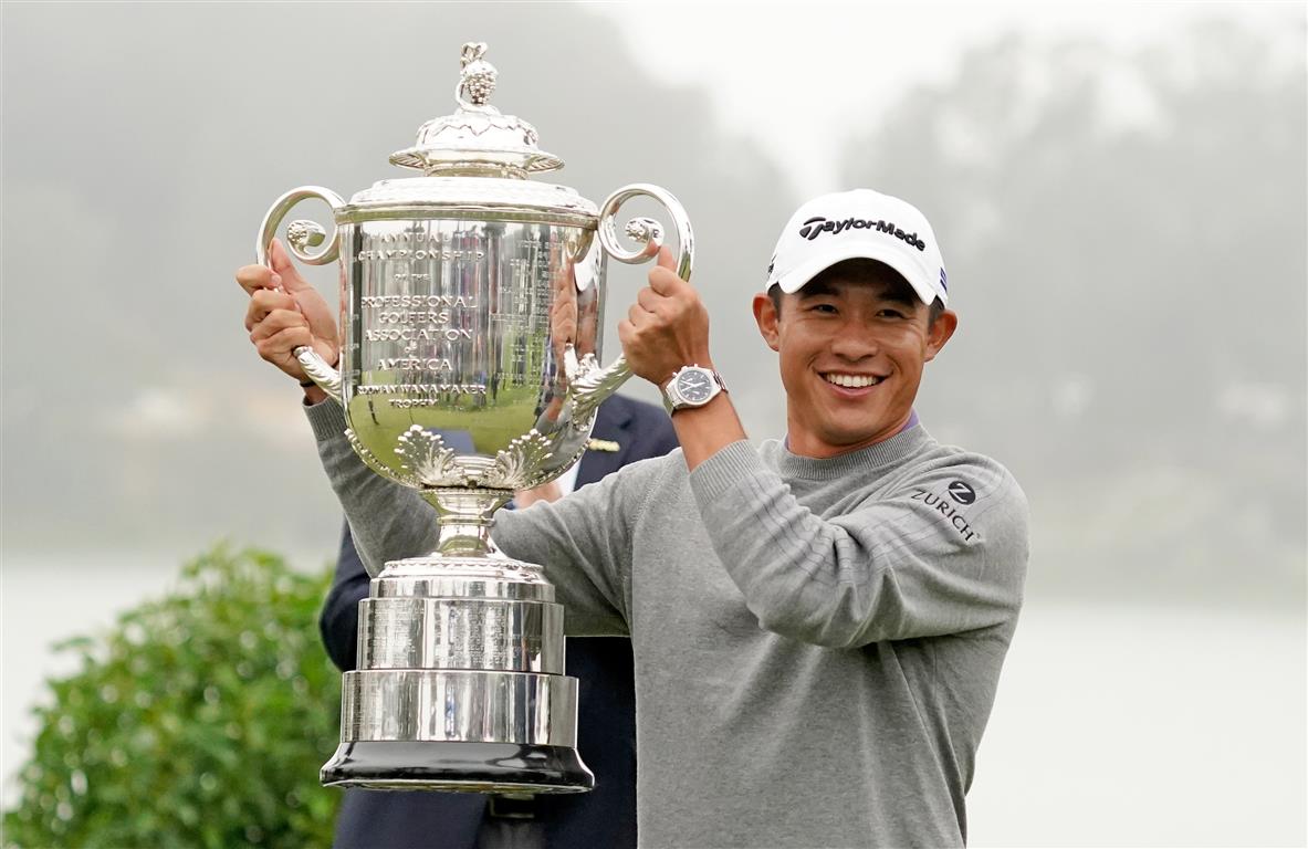 Collin Morikawa celebrates with the Wanamaker Trophy after winning the 2020 PGA Championship at...