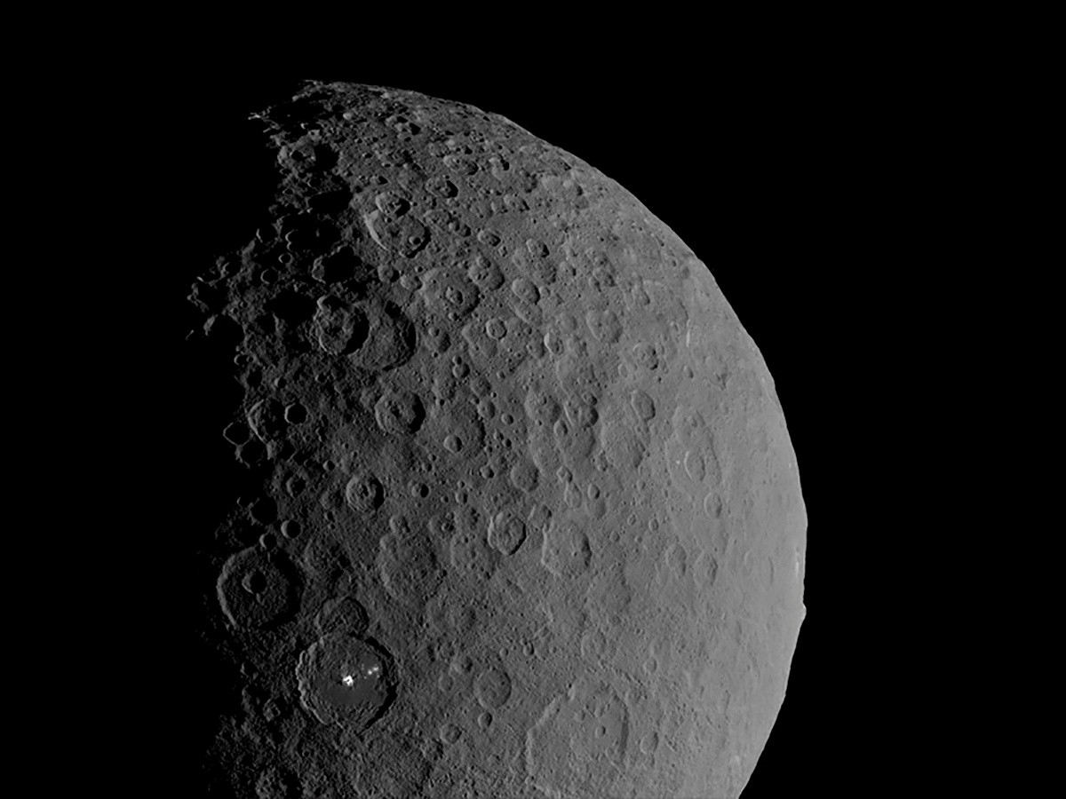 Occator Crater and Ahuna Mons appear together in this view of the dwarf planet Ceres obtained by...