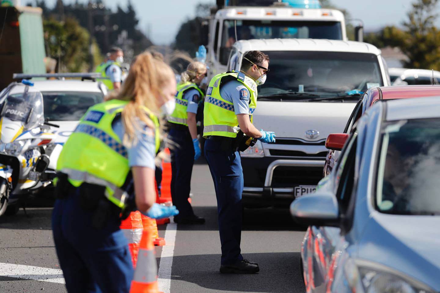 Police speak to motorists on the southern motorway at Bombay near Auckland after setting up...