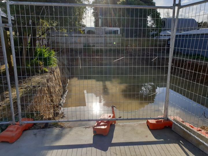 Hanna Carpenter says the lack of a secure fence, as seen here at the end of July, is putting her...