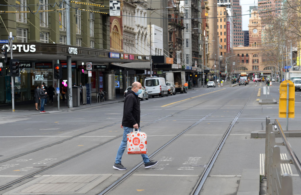 A man in a mask on a central Melbourne street. Photo: Getty