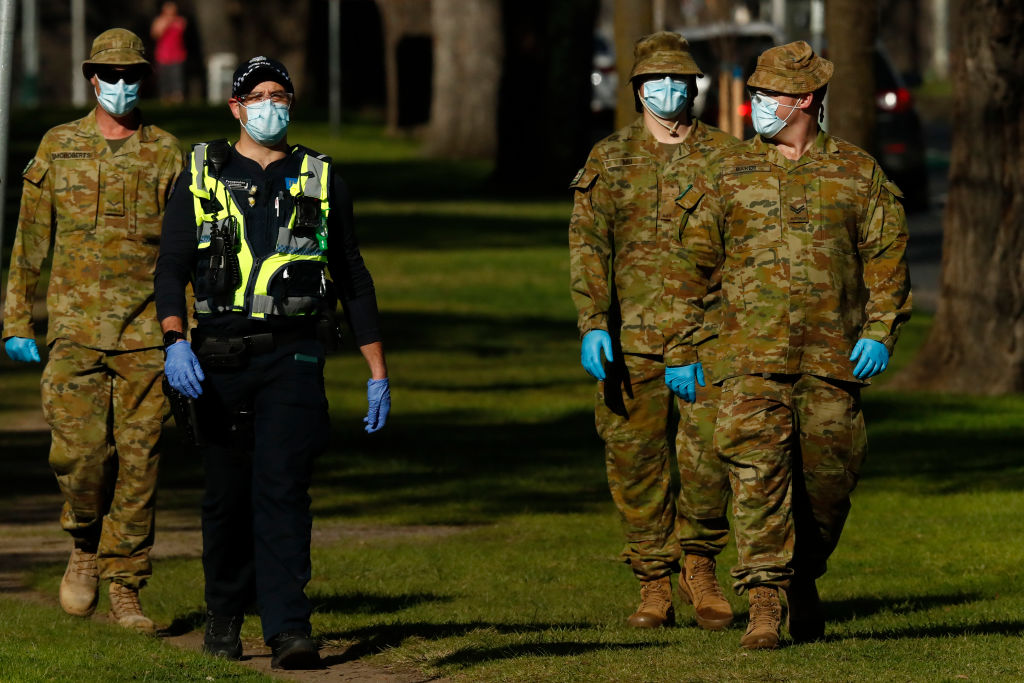 Police and Australian Defence Force members patrol the streets of Melbourne. Photo: Getty