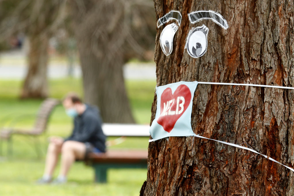 A mask on a tree during lockdown in Melbourne. Photo: Getty