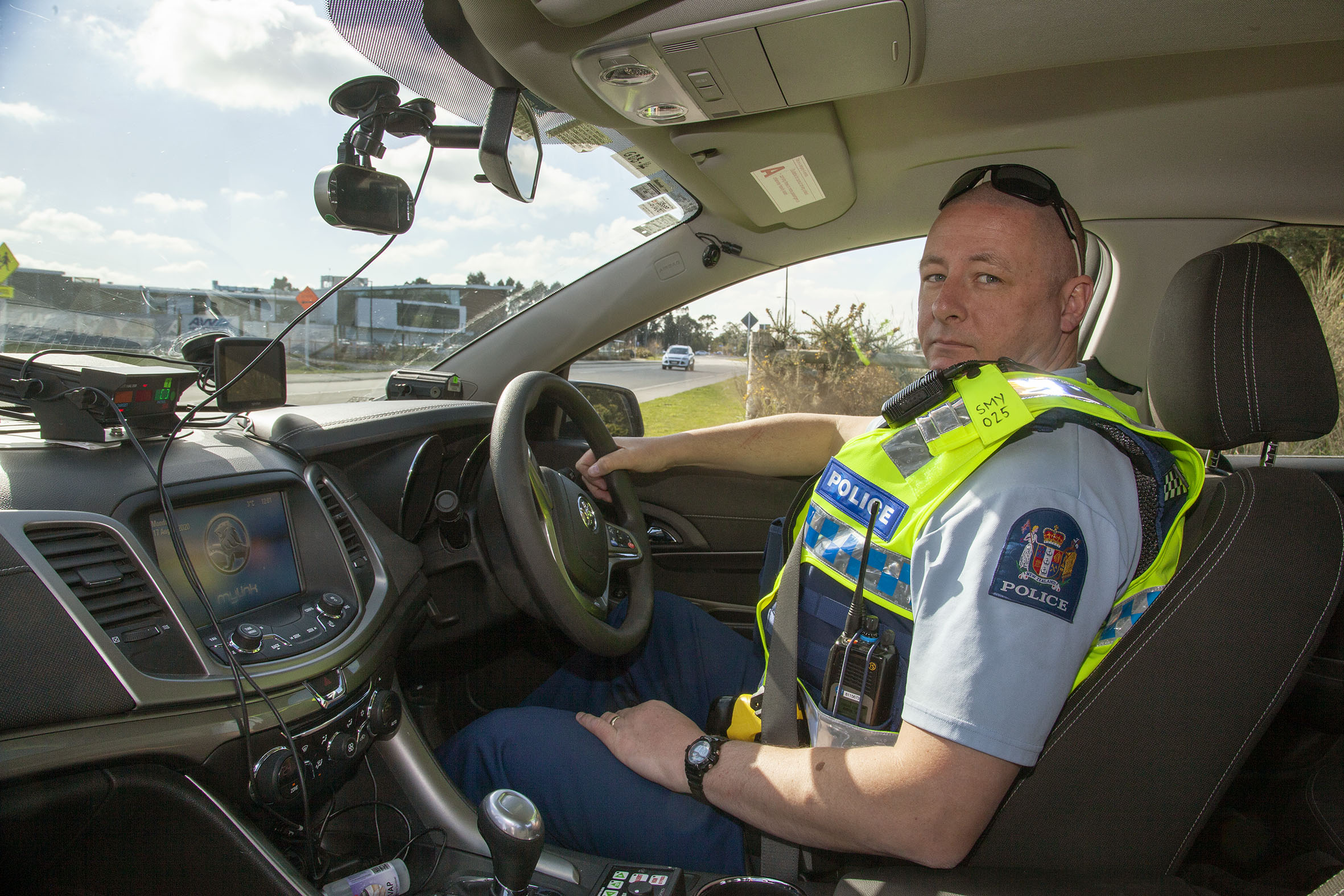 Senior constable Scott Mclachlan outside Rolleston College. Photo: Geoff Sloan