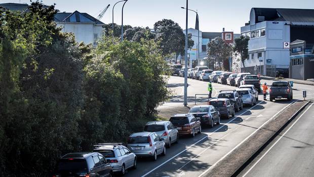 Central Auckland residents queue to be tested at the Mt Eden Community Testing Centre in New...