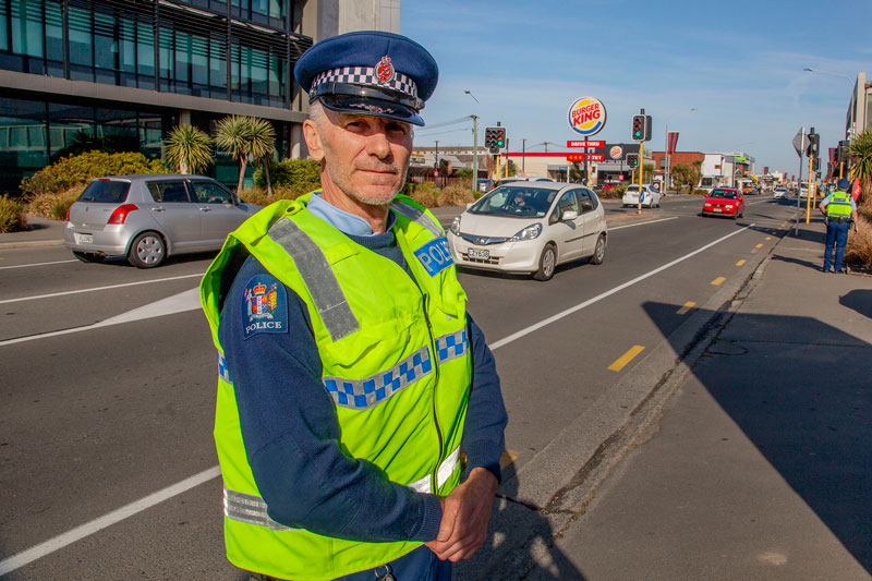 Senior Constable Clay Penrose checking up on seatbelts and cellphone use at the wheel on Lincoln...