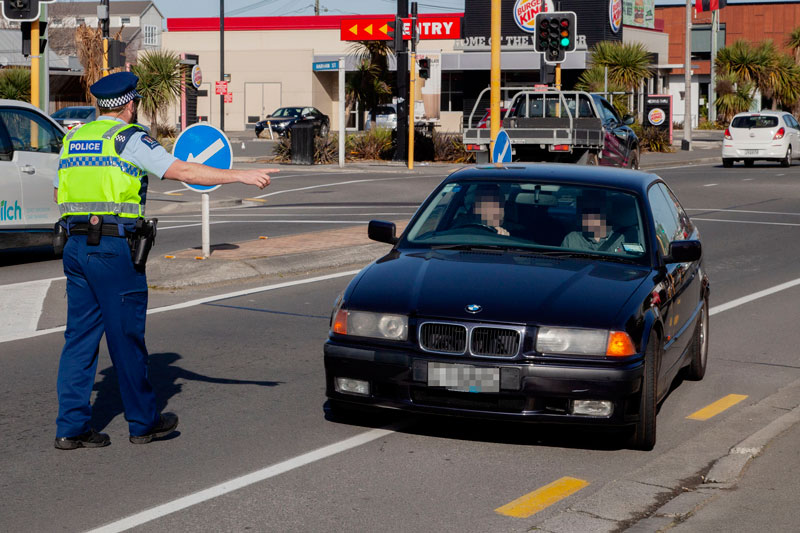 Senior Constable Clay Penrose checking up on seatbelts and cellphone use at the wheel on Lincoln...