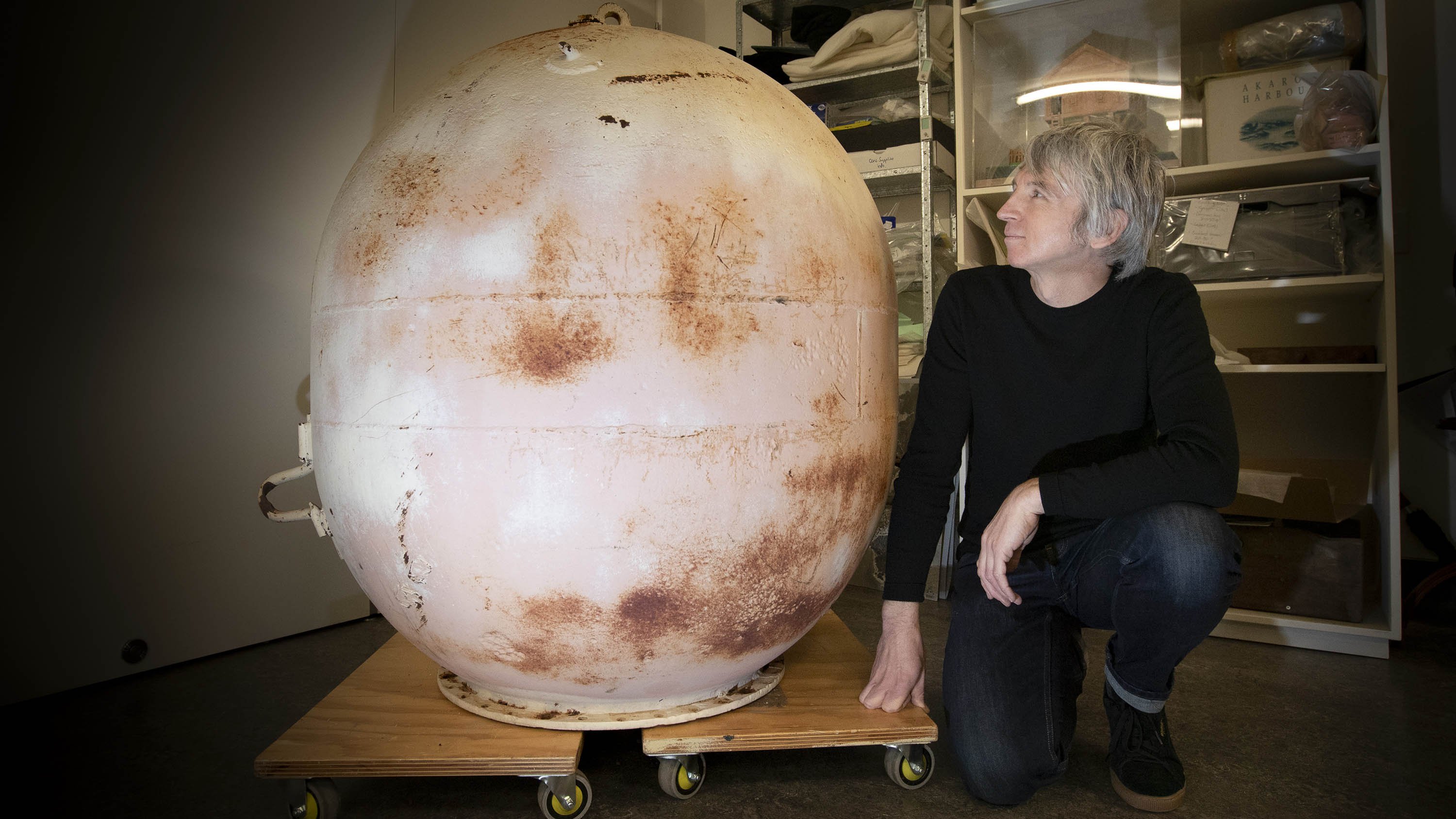 Museum collections manager Daniel Smith with the naval sea mine. Photo: Newsline / CCC