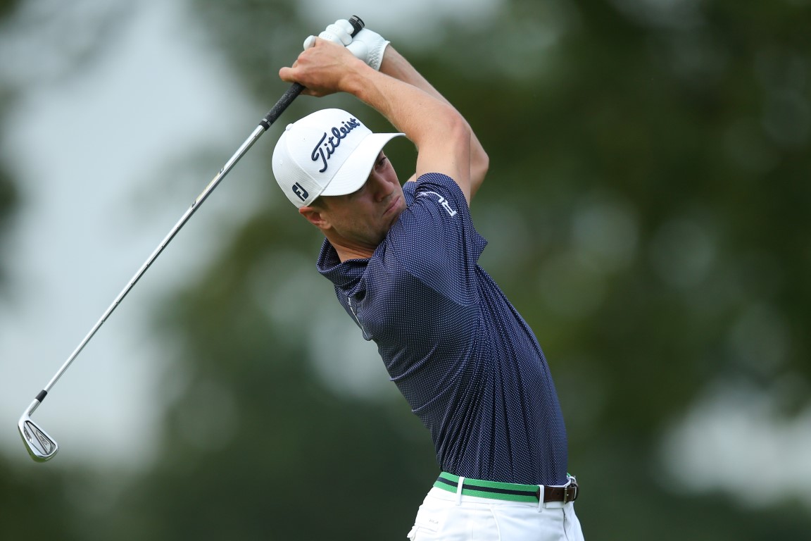 Justin Thomas hits a tee shot on the 3rd hole during the first round. Photo: Brad Penner-USA...